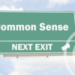 Road sign saying 'common sense' next exit