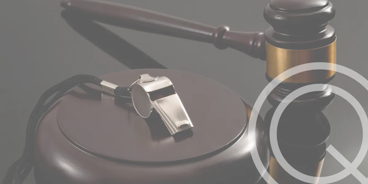 Whistle and gavel on desk