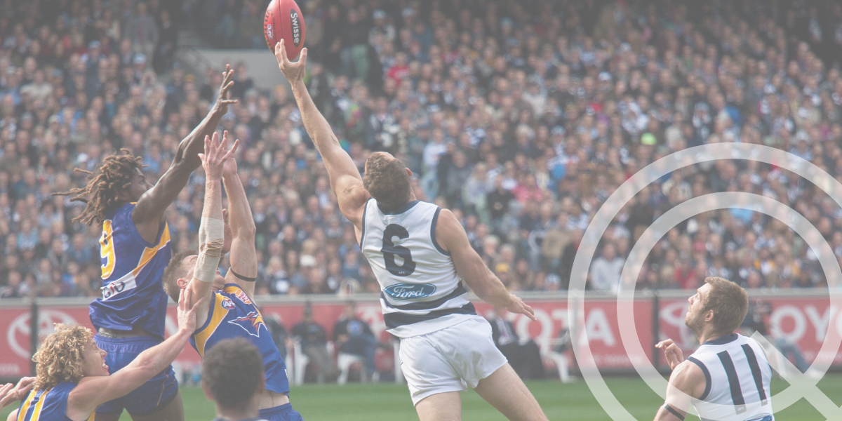 AFL players contesting a ball